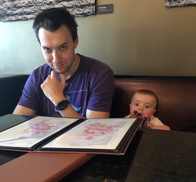 Me and my 8-month-old son at a booth in a Chinese restaraunt